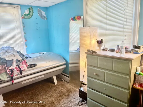 a bed room with a bed and a dresser