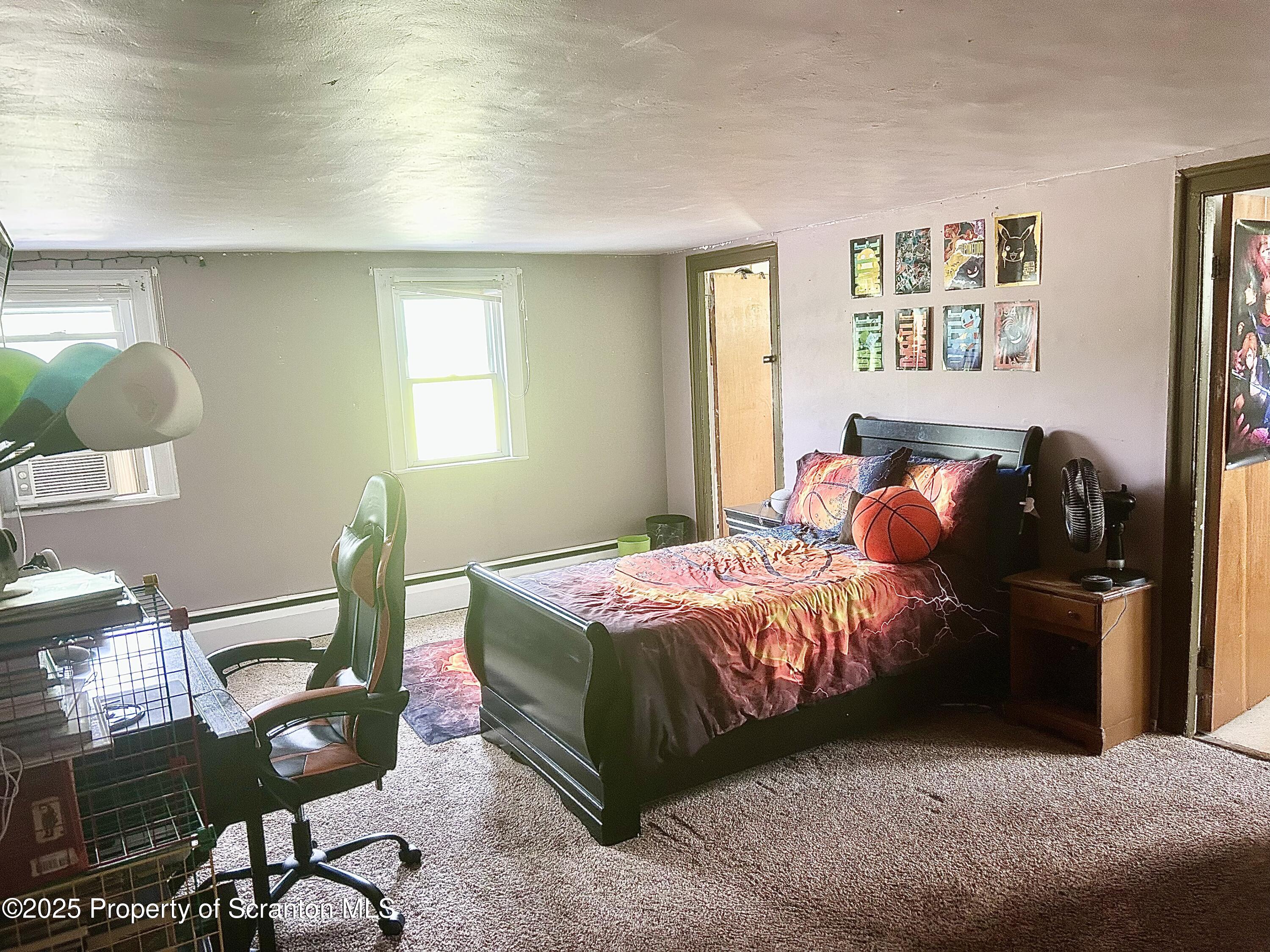 536 Old Rte 11 New Milford, PA 18834 - Photo 21 of 36 a bedroom with a bed and wooden floor