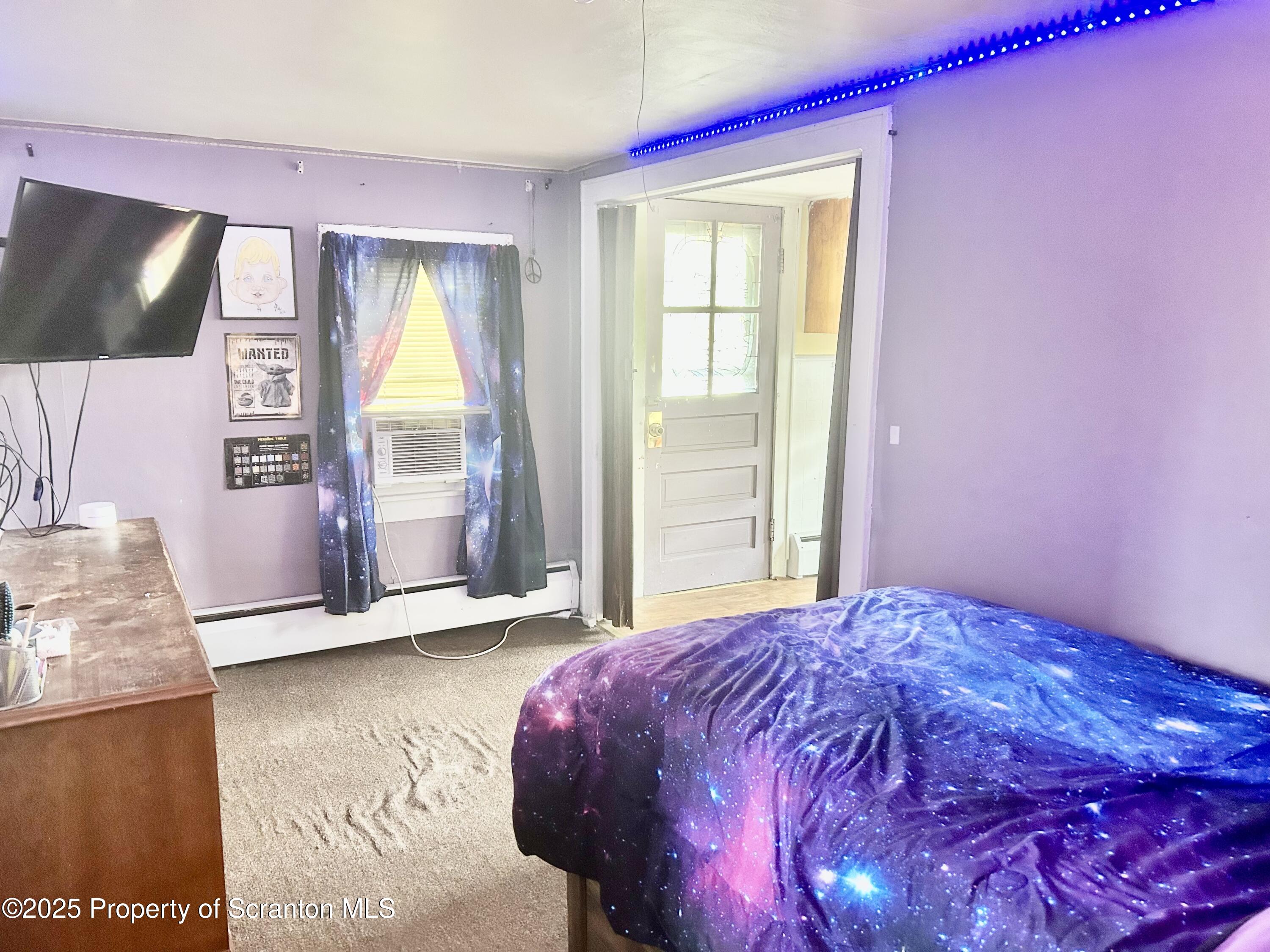 536 Old Rte 11 New Milford, PA 18834 - Photo 24 of 36 a bedroom with a bed and a flat screen tv