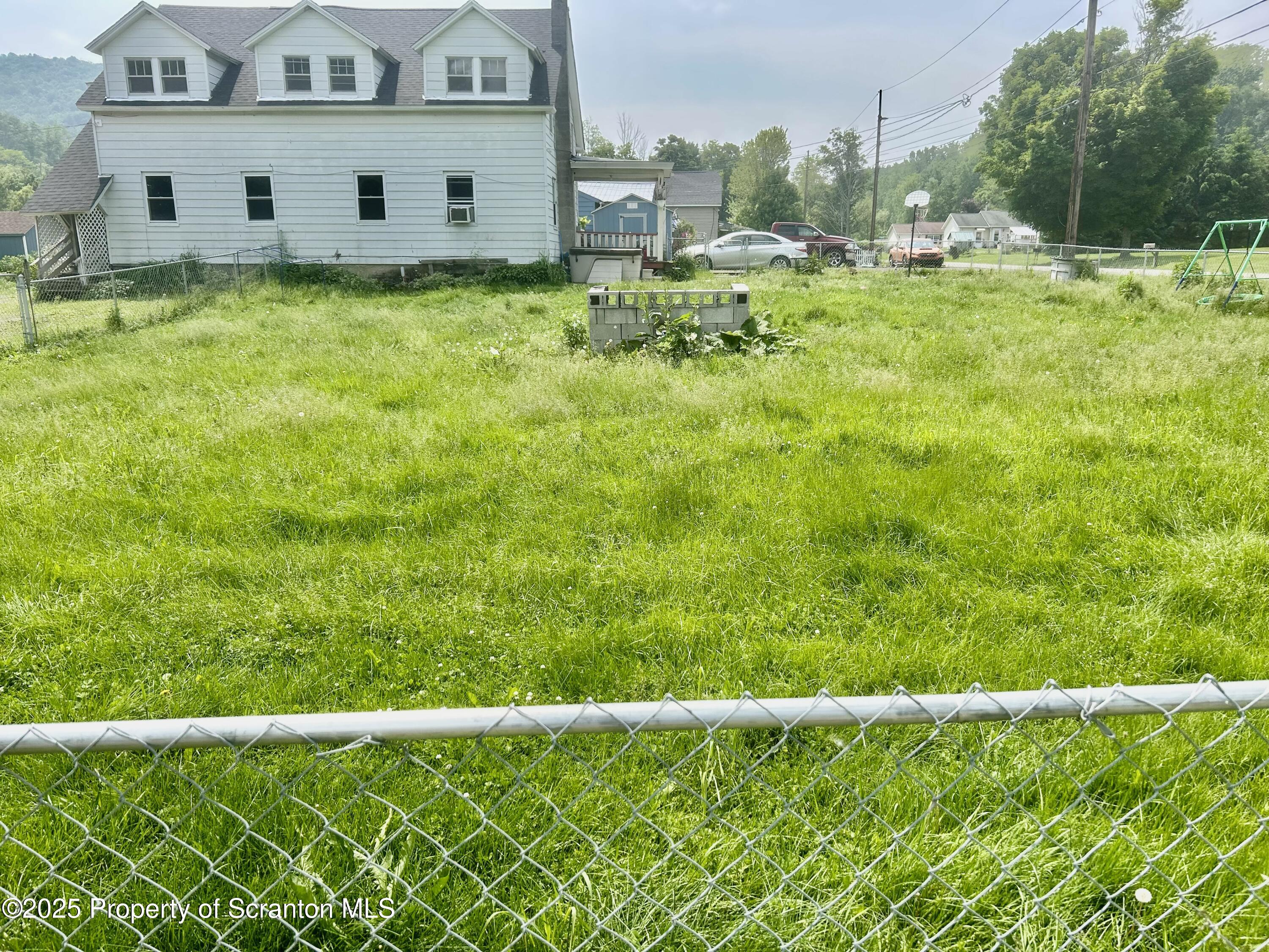 536 Old Rte 11 New Milford, PA 18834 - Photo 34 of 36 a backyard of a building with lawn chairs