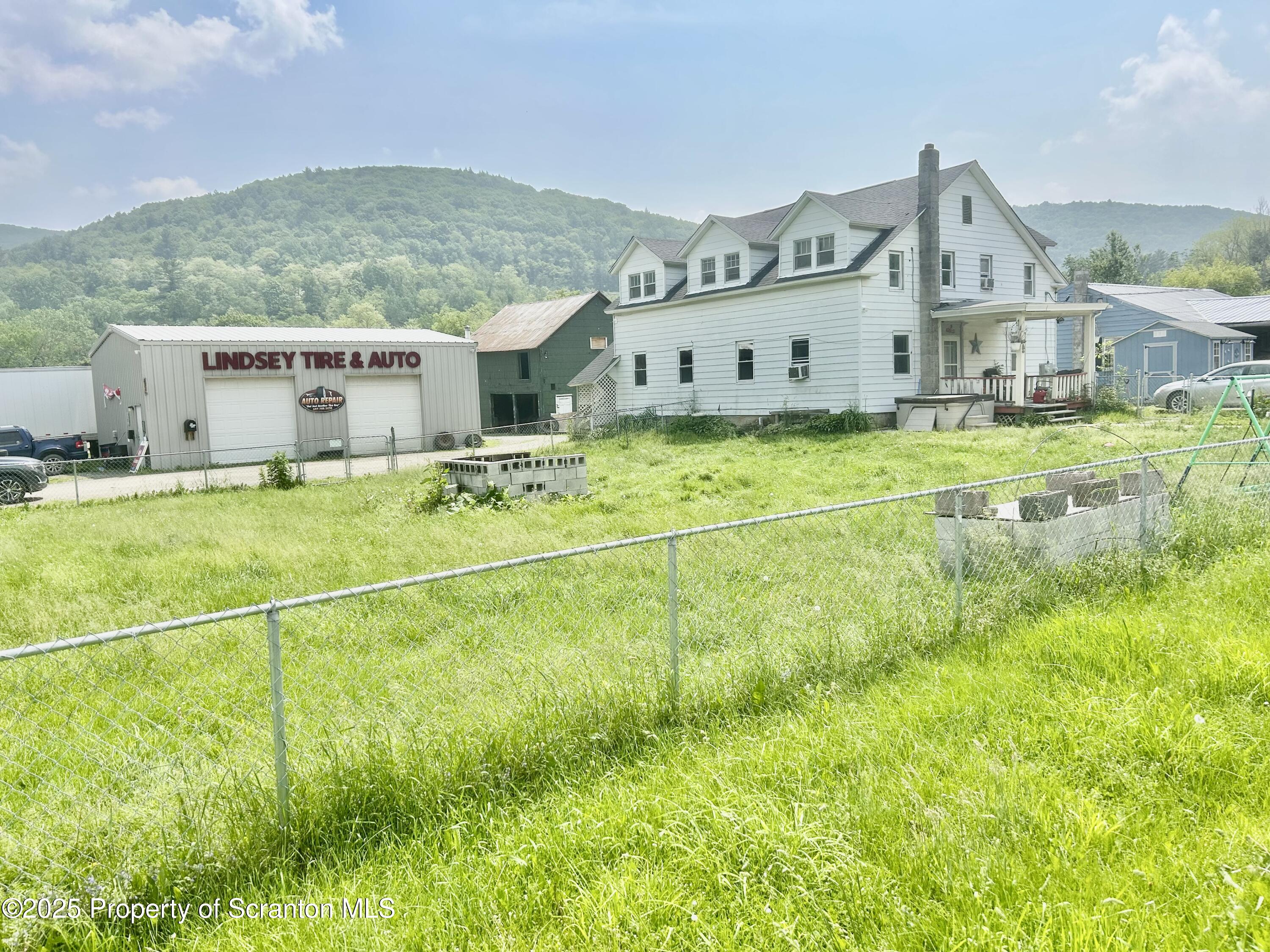 536 Old Rte 11 New Milford, PA 18834 - Photo 35 of 36 a view of a house with a big yard and large trees
