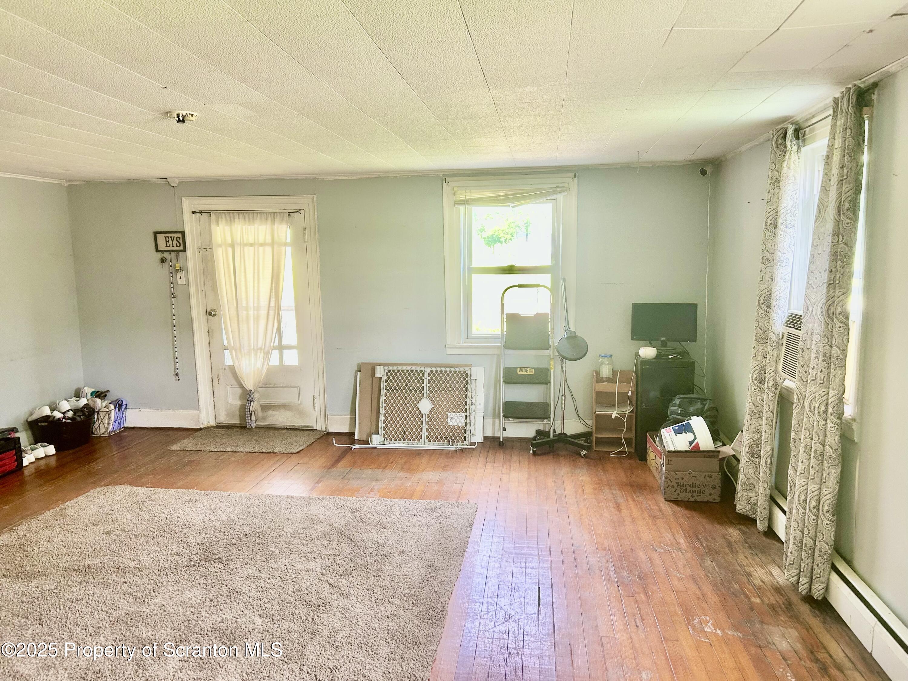 536 Old Rte 11 New Milford, PA 18834 - Photo 4 of 36 a view of a room with gym equipment and a large window