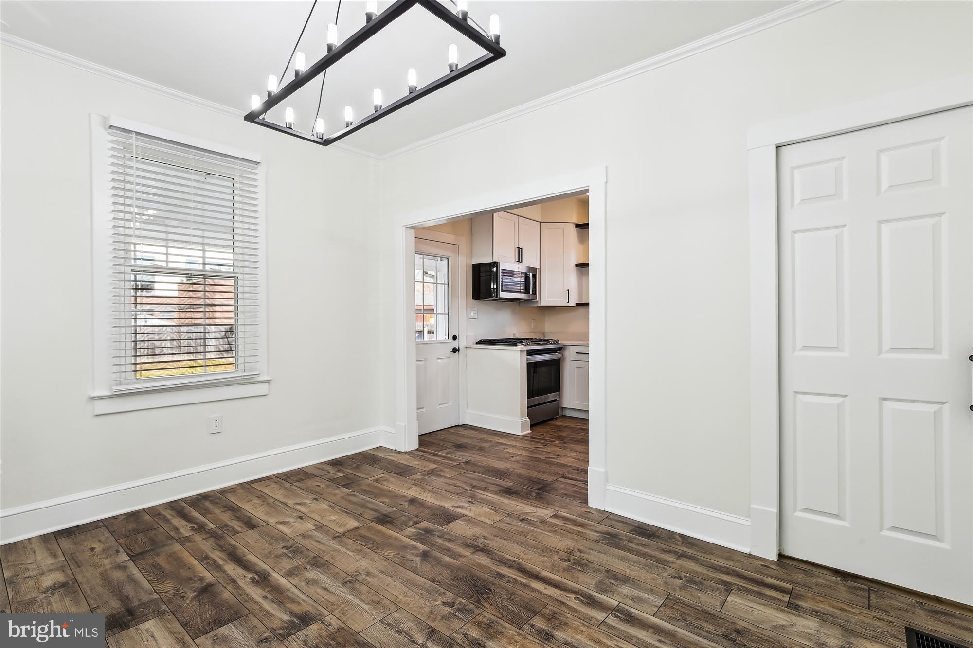 3107 9th Road North Arlington, VA 22201 - Photo 14 of 34 a view of a kitchen with wooden floor and a kitchen space