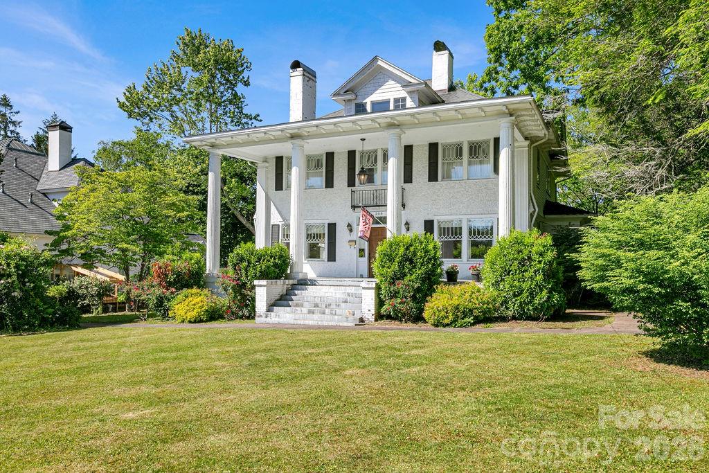 208 West Probart Street Brevard, NC 28712 - Photo 2 of 48 a front view of a house with a yard