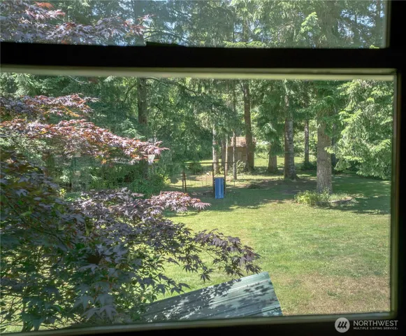a view of balcony and yard
