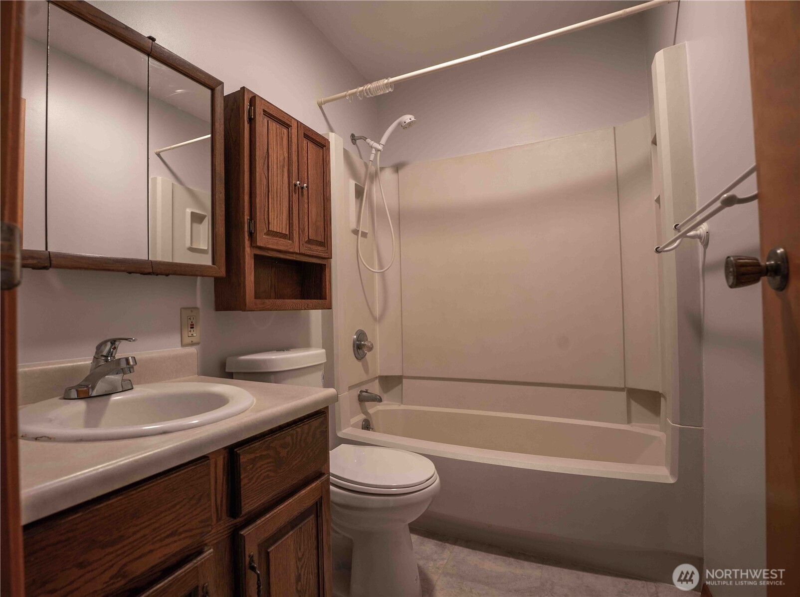 293154 Highway 101 Quilcene, WA 98376 - Photo 15 of 40 a bathroom with a sink a toilet and shower
