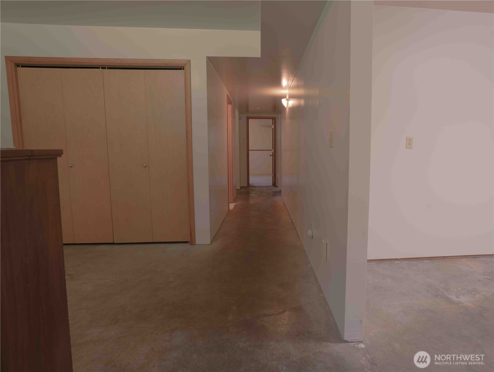 293154 Highway 101 Quilcene, WA 98376 - Photo 21 of 40 a view of a hallway with an empty room