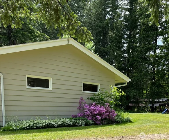 a view of a tree in a yard