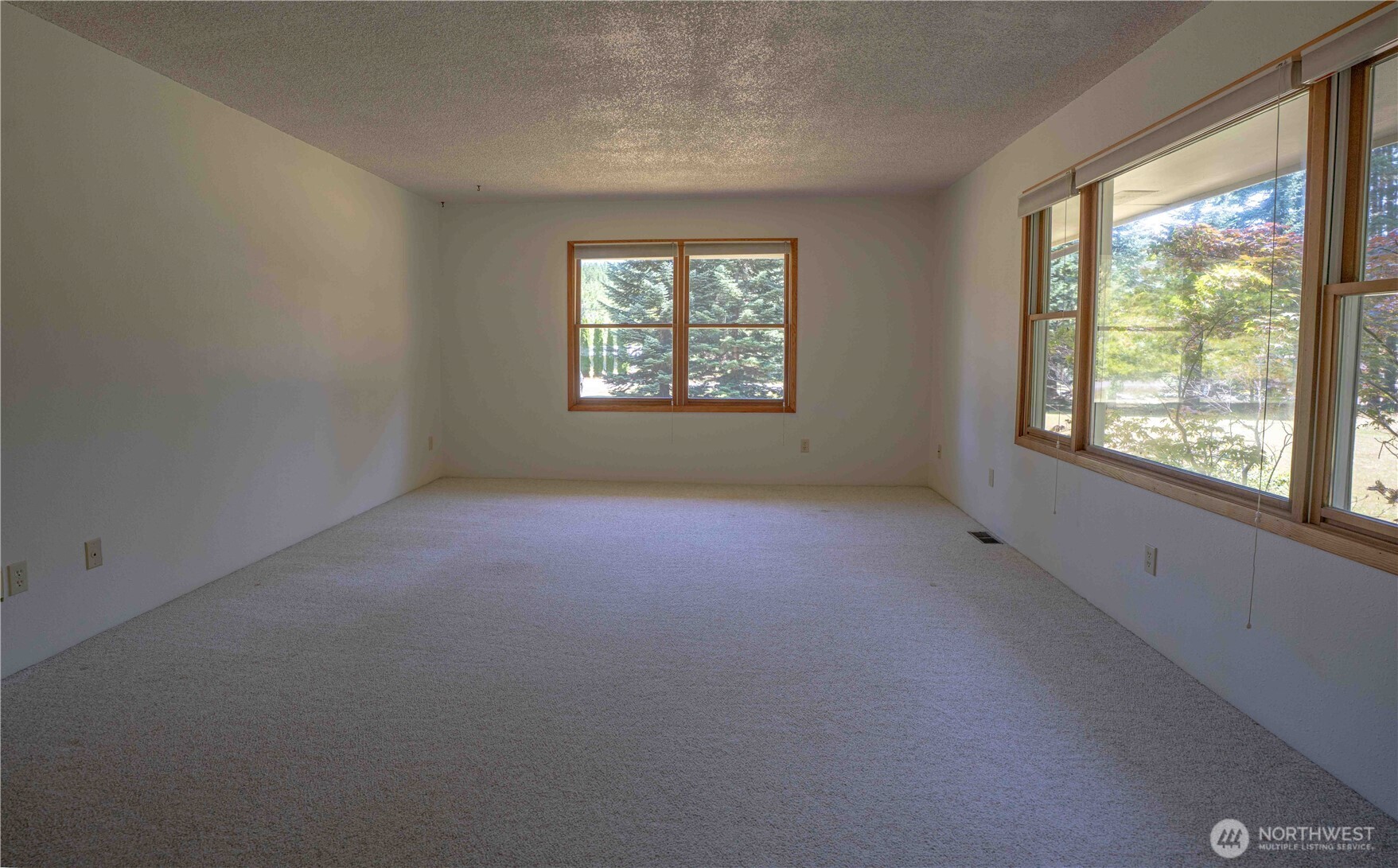 293154 Highway 101 Quilcene, WA 98376 - Photo 5 of 40 an empty room with a window