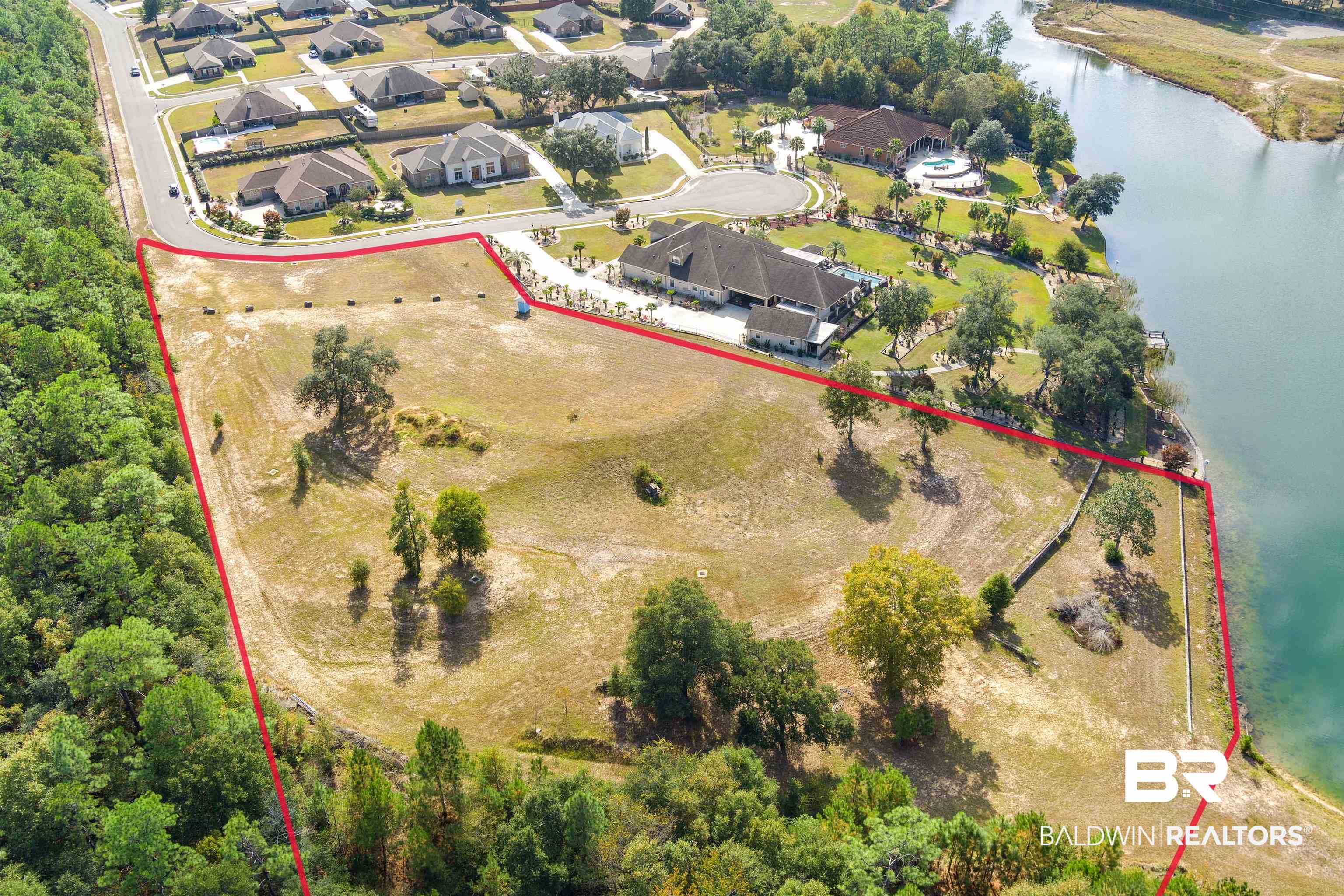 8512 Crepe Myrtle Court Mobile, AL 36619 - Photo 1 of 10 Aerial perspective of suburban area featuring a nearby body of water and property parcel outlined
