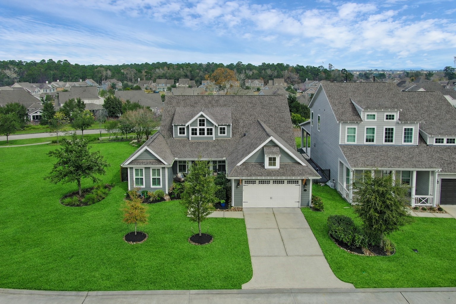 2223 Pintail Lane Conroe, TX 77384 - Photo 33 of 39 Large Green Space on one side of the home to enhance your feeling of Privacy (grass virtually staged)