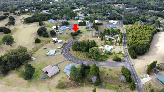 an aerial view of a houses with yard