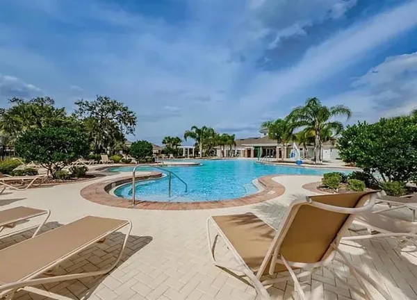 a view of a swimming pool with a patio