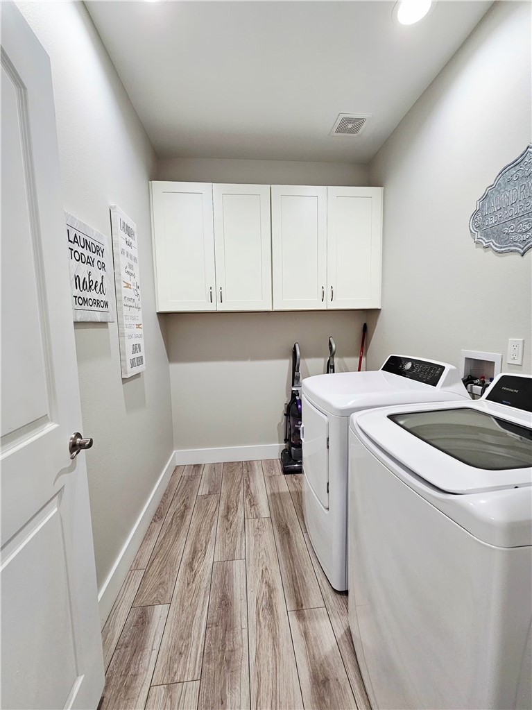 122 Ridge Harbor Drive Rockport, TX 78382 - Photo 20 of 34 a view of storage and utility room with washer and dryer