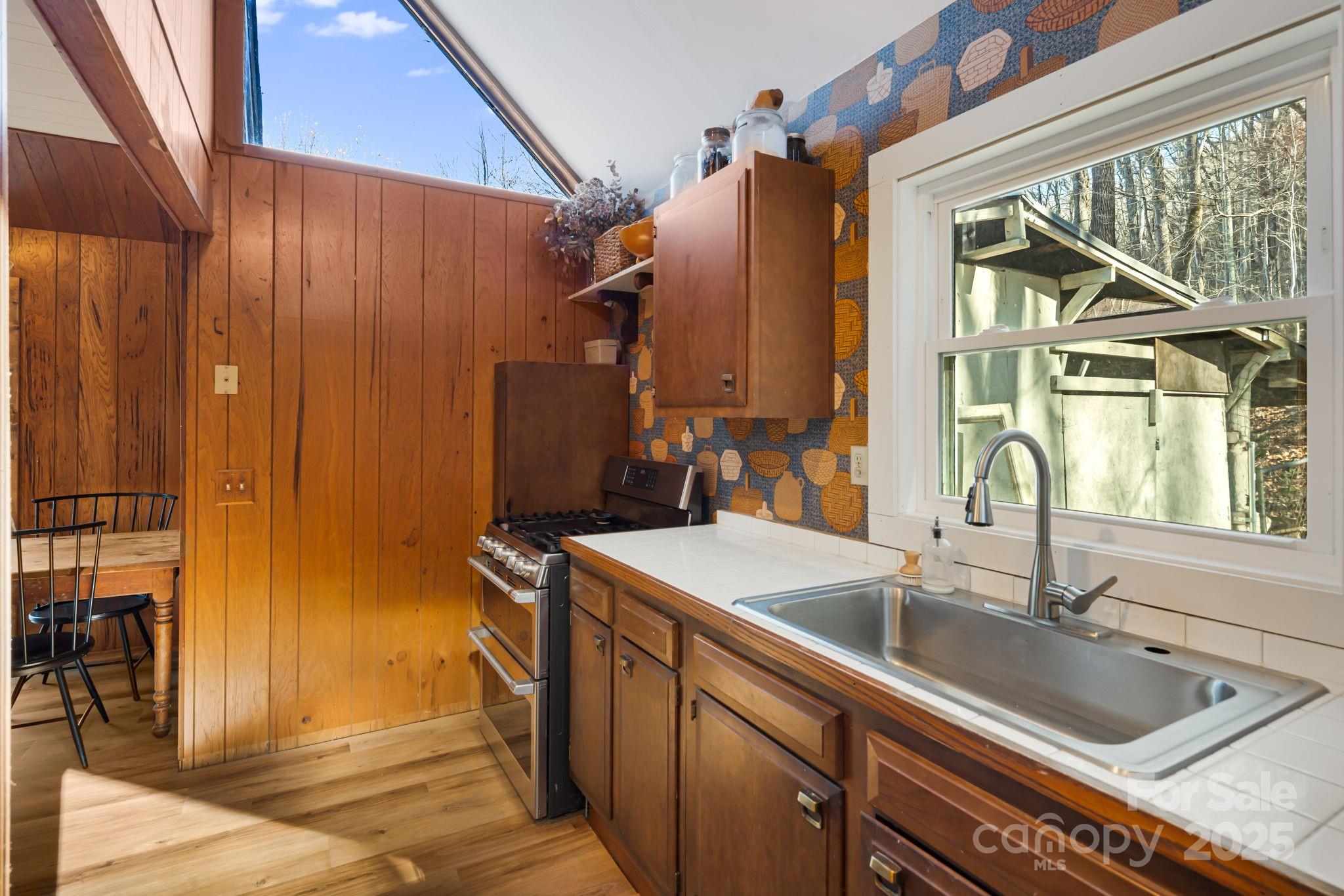 1877 Secluded Valley Road Marshall, NC 28753 - Photo 15 of 31 a bathroom with a sink and a mirror