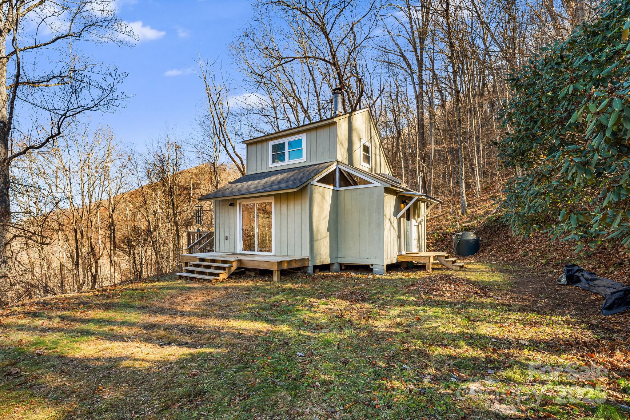 1877 Secluded Valley Road Marshall, NC 28753 - Photo 2 of 31 a view of a house with a yard