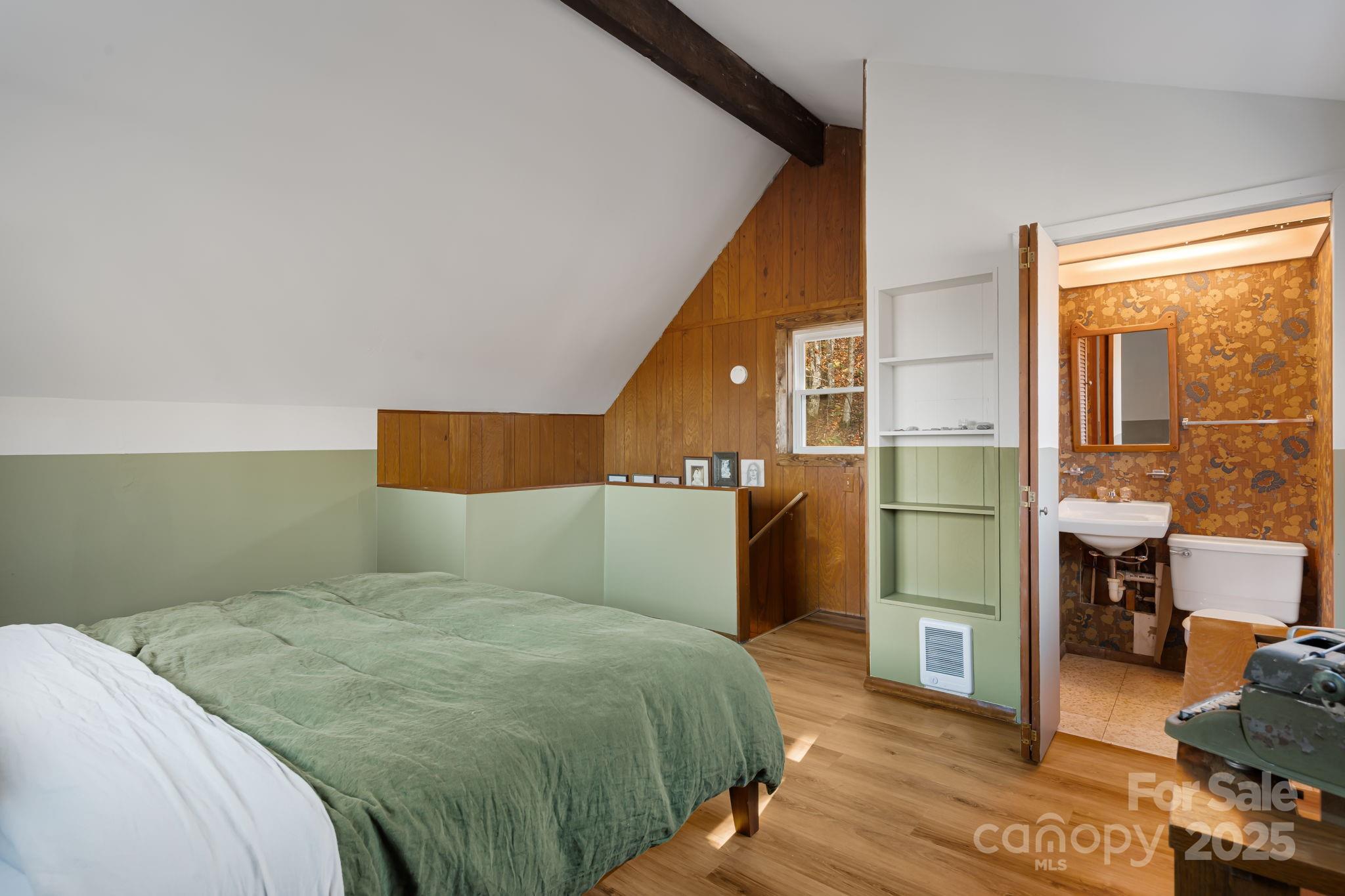 1877 Secluded Valley Road Marshall, NC 28753 - Photo 22 of 31 a bedroom with a bed and a window