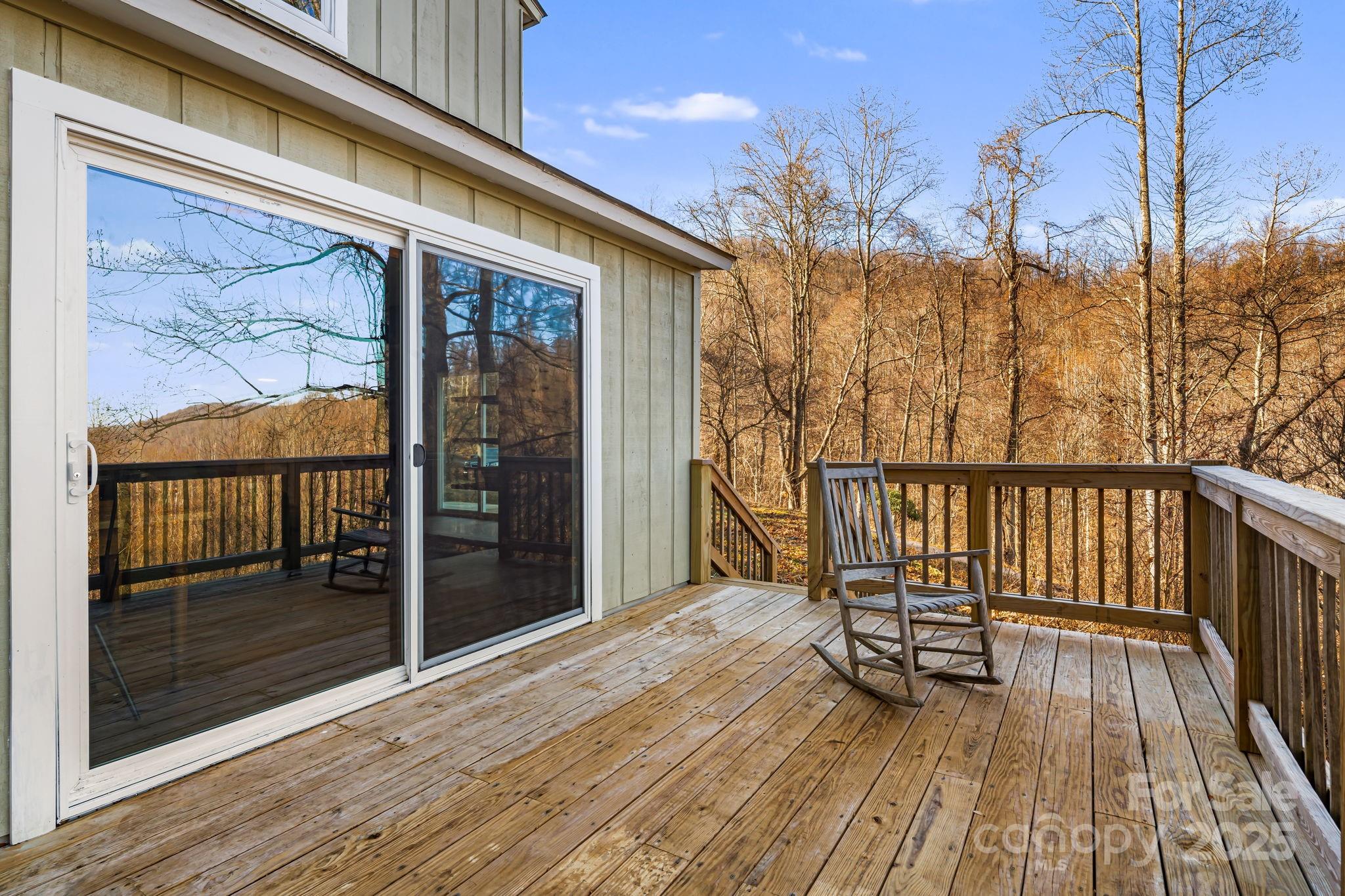 1877 Secluded Valley Road Marshall, NC 28753 - Photo 25 of 31 a view of a balcony with wooden floor and bench