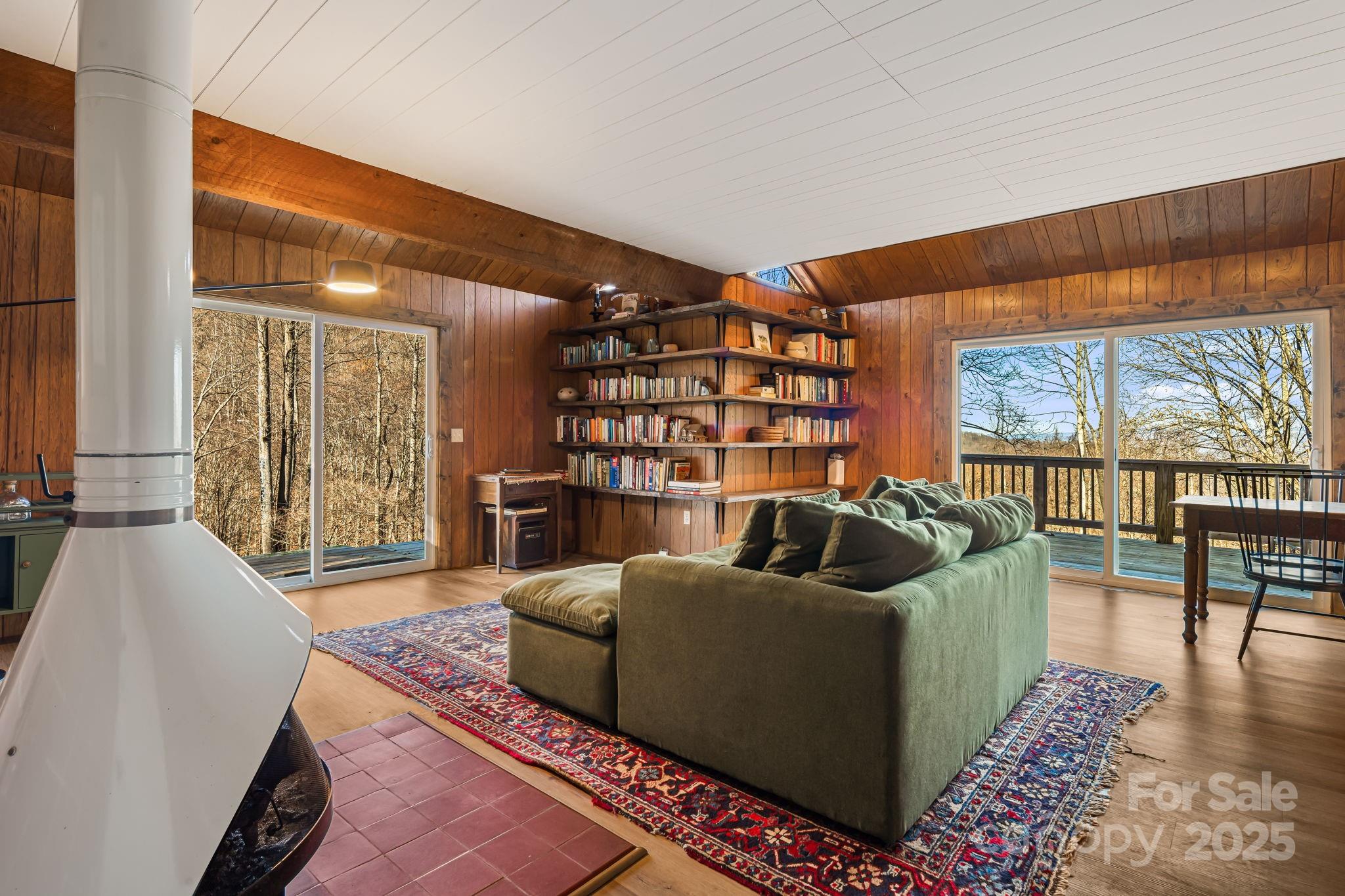 1877 Secluded Valley Road Marshall, NC 28753 - Photo 5 of 31 a living room with furniture and a large window