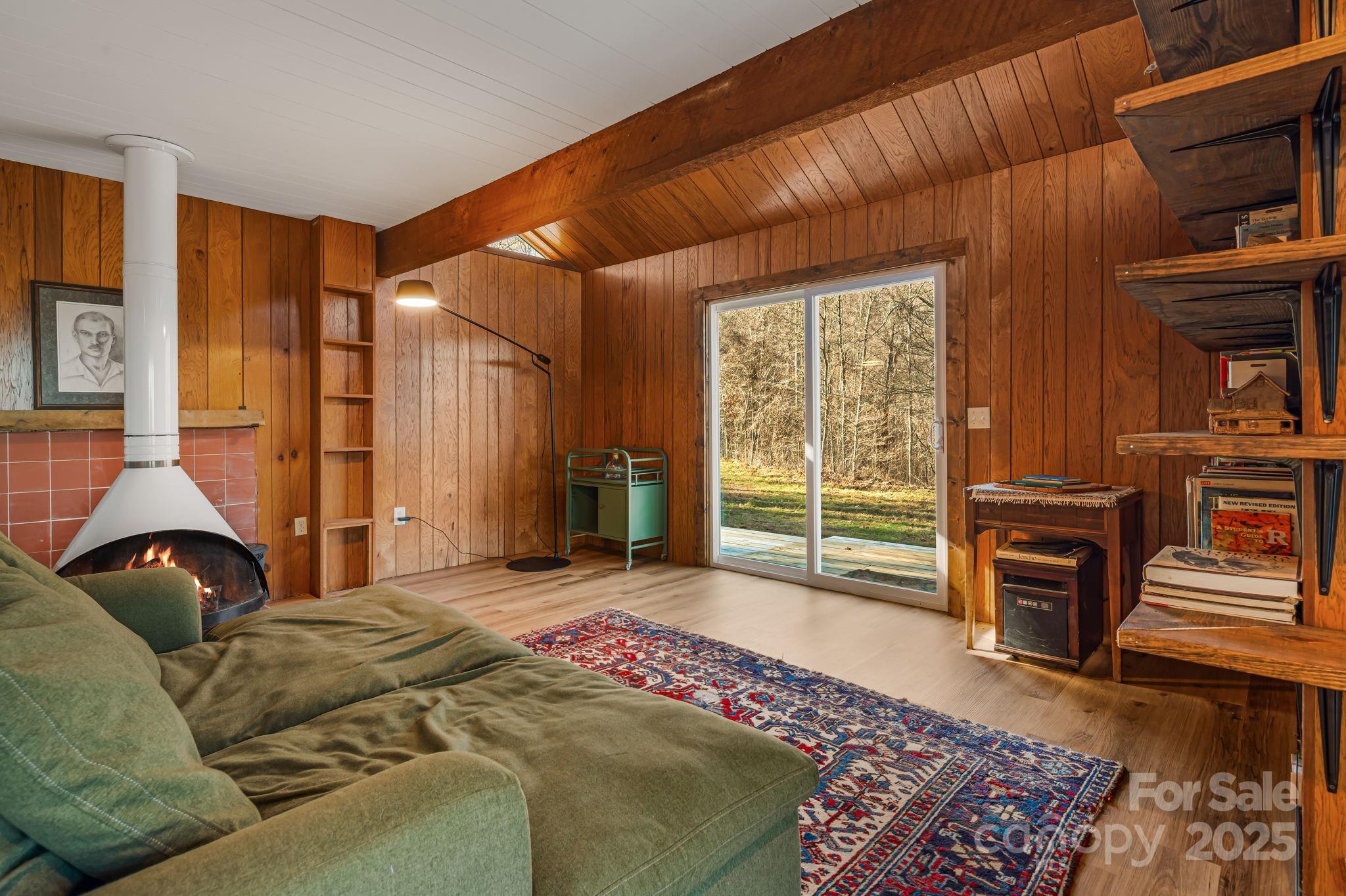 1877 Secluded Valley Road Marshall, NC 28753 - Photo 6 of 31 a bedroom with a bed and wooden floor