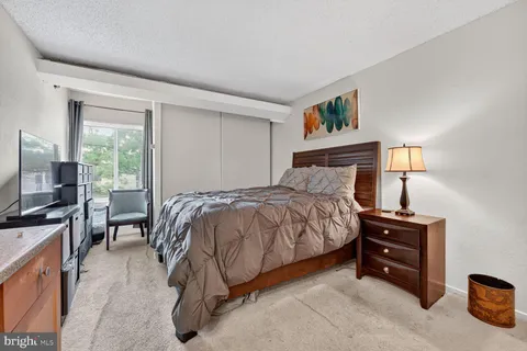 a bedroom with a bed and furniture