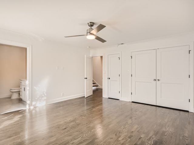 a view of an empty room and wooden floor
