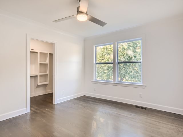 an empty room with a empty space and a window