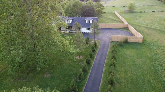 a view of a back yard from a balcony