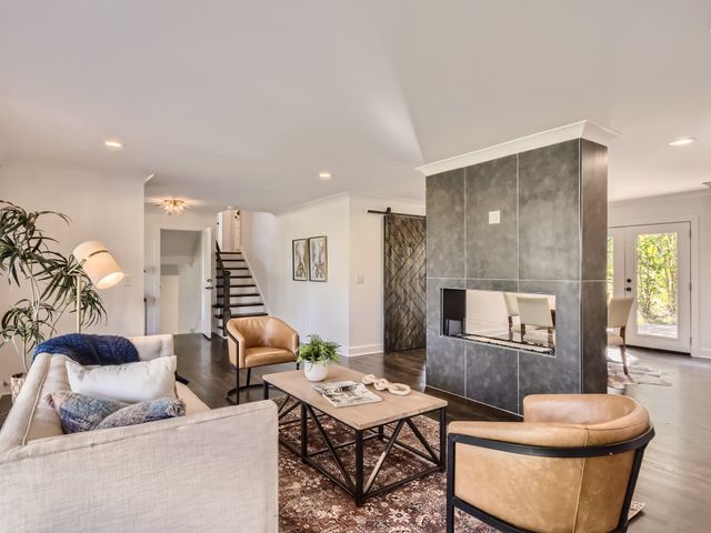 a living room with furniture and a table