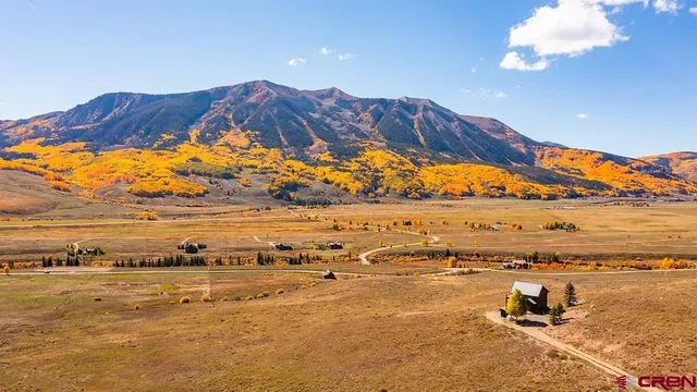 a view of an ocean with mountain