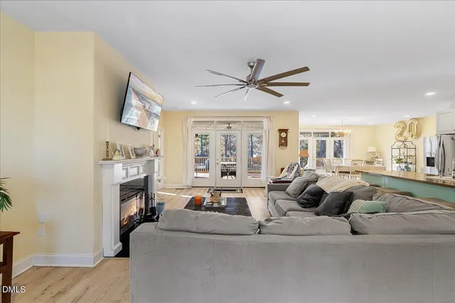 a living room with fireplace furniture and a flat screen tv