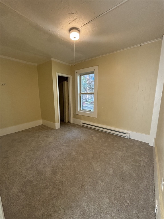 9 Pleasant Terrace Worcester, MA 01609 - Photo 11 of 27 an empty room with windows and closet