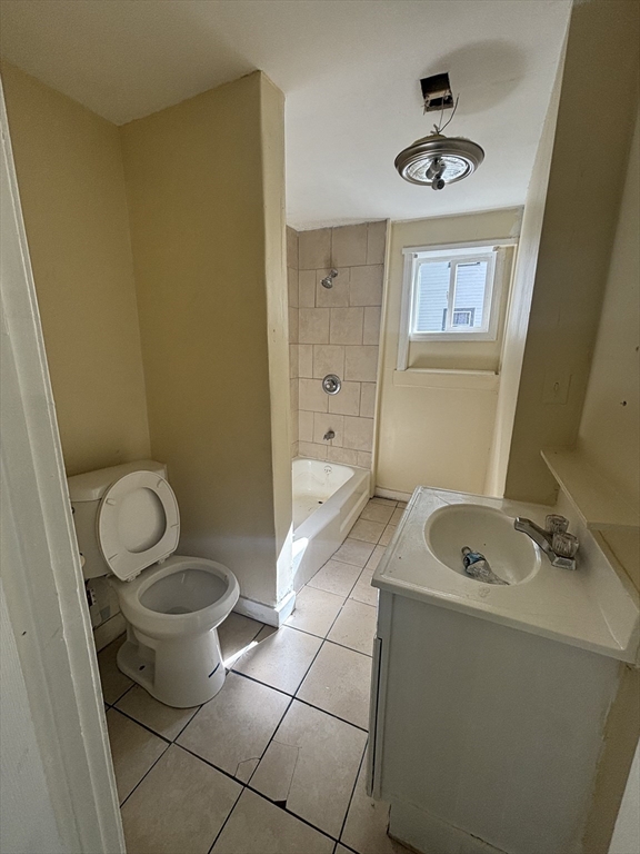 9 Pleasant Terrace Worcester, MA 01609 - Photo 14 of 27 a bathroom with a granite countertop sink a toilet and a mirror