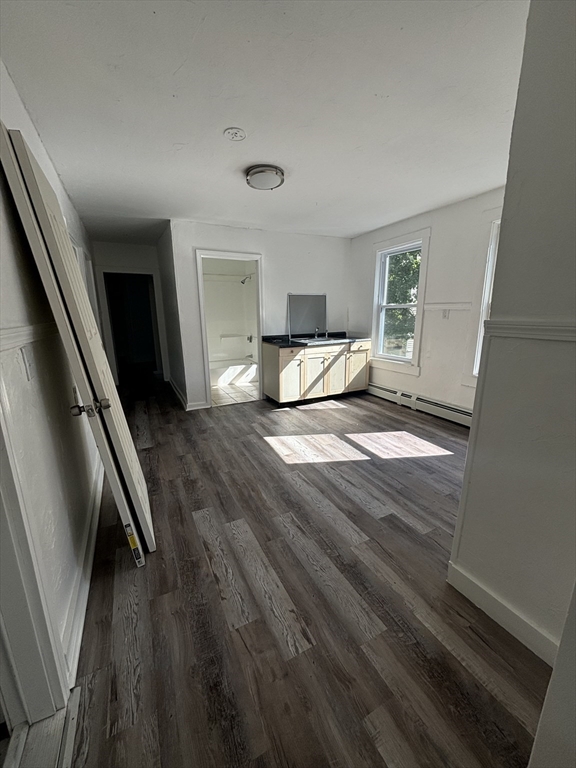 9 Pleasant Terrace Worcester, MA 01609 - Photo 16 of 27 a view of a livingroom with wooden floor and stairs