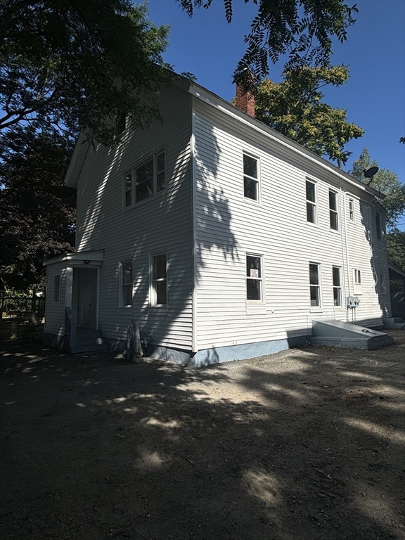 9 Pleasant Terrace Worcester, MA 01609 - Photo 2 of 27 a view of a white house with a yard