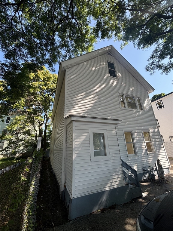 9 Pleasant Terrace Worcester, MA 01609 - Photo 4 of 27 a side view of a house with a yard
