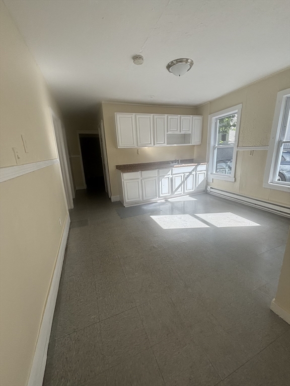 9 Pleasant Terrace Worcester, MA 01609 - Photo 8 of 27 a view of an empty room with a window