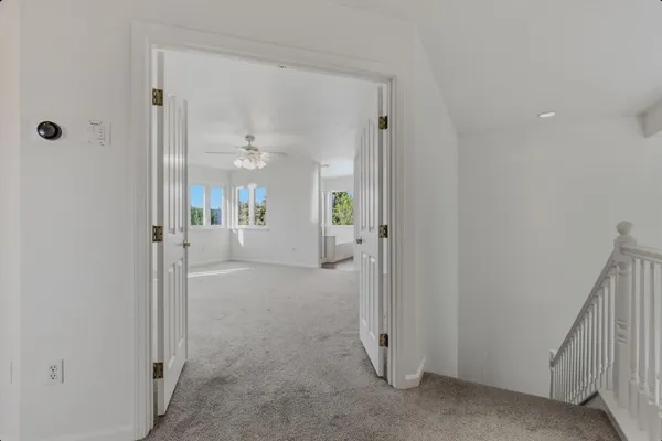 a view of a bathroom with a glass door shower