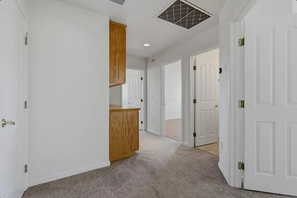 a view of a storage & utility room with a sink