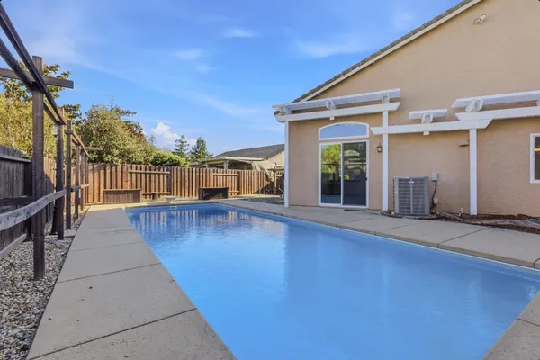 a view of swimming pool with seating space