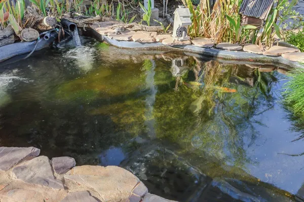 a bathroom with a toilet sink and granite