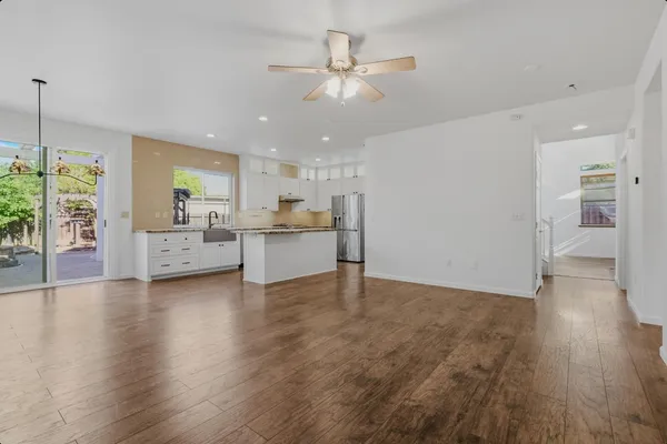 a view of a kitchen with a sink and a window
