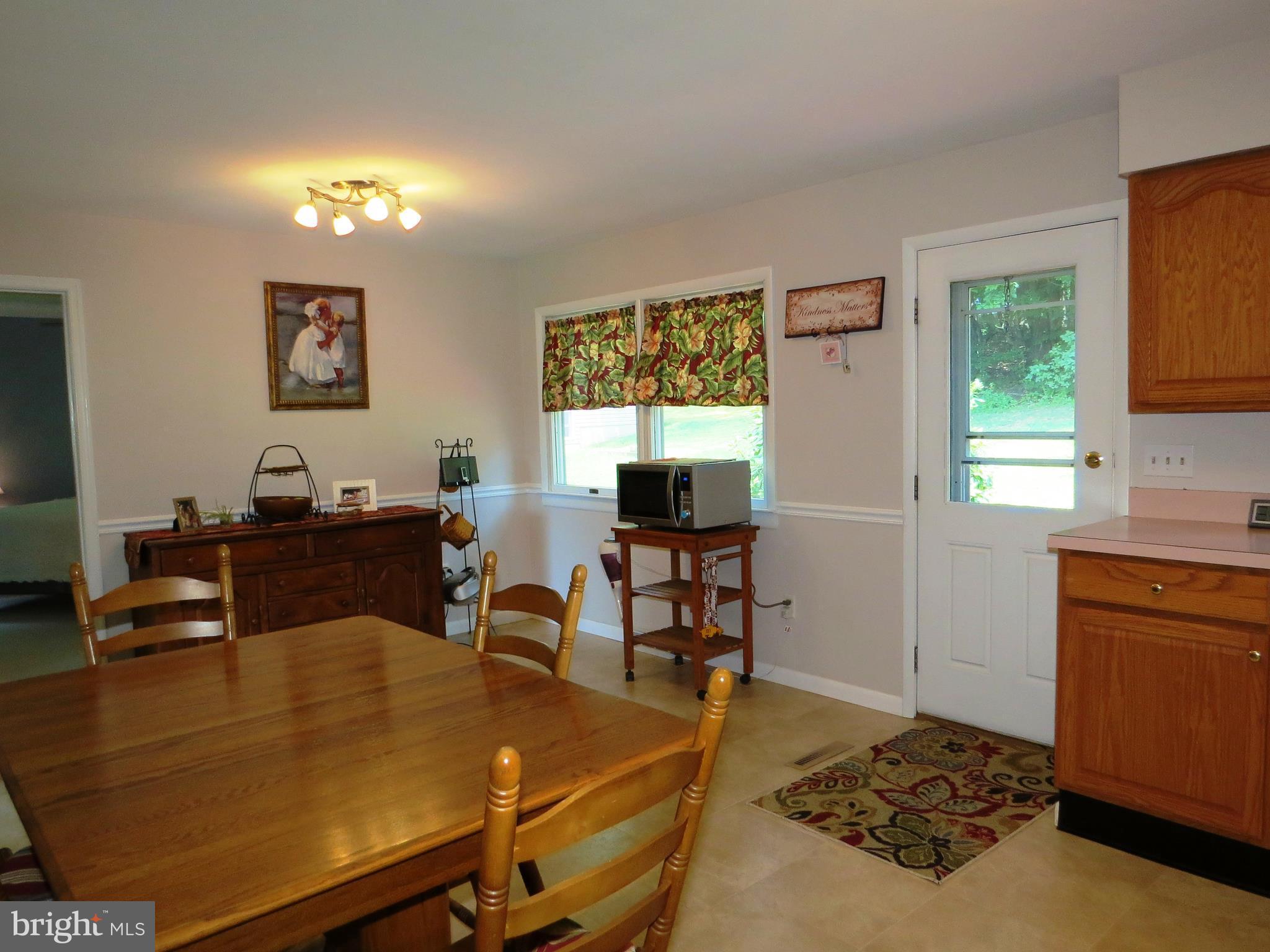 3165 Falls Road Hampstead, MD 21074 - Photo 4 of 30 a view of a workspace with furniture and a window