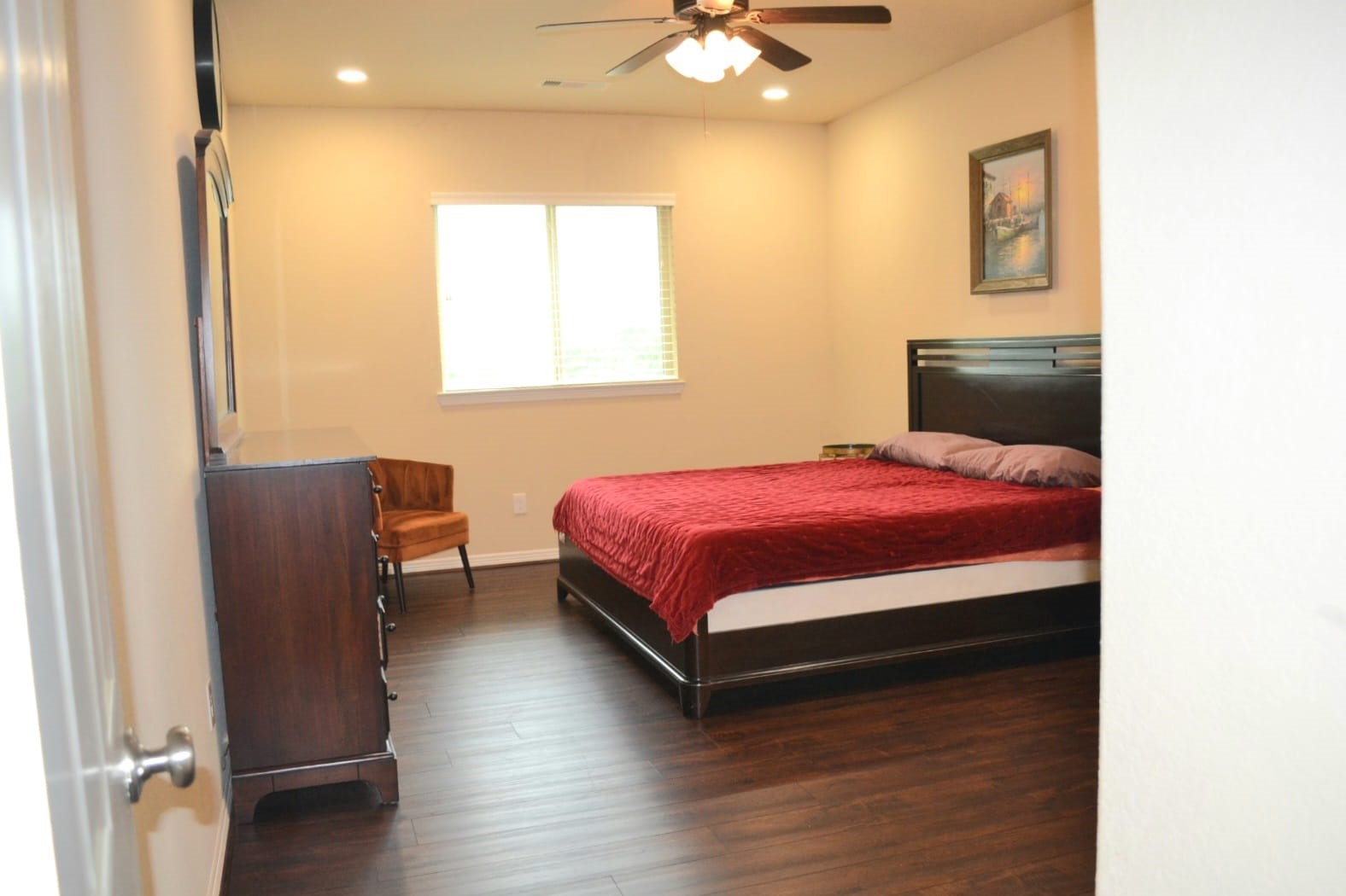 5206 Jacob Ridge Court Sugar Land, TX 77479 - Photo 32 of 42 a bedroom with a bed and wooden floor