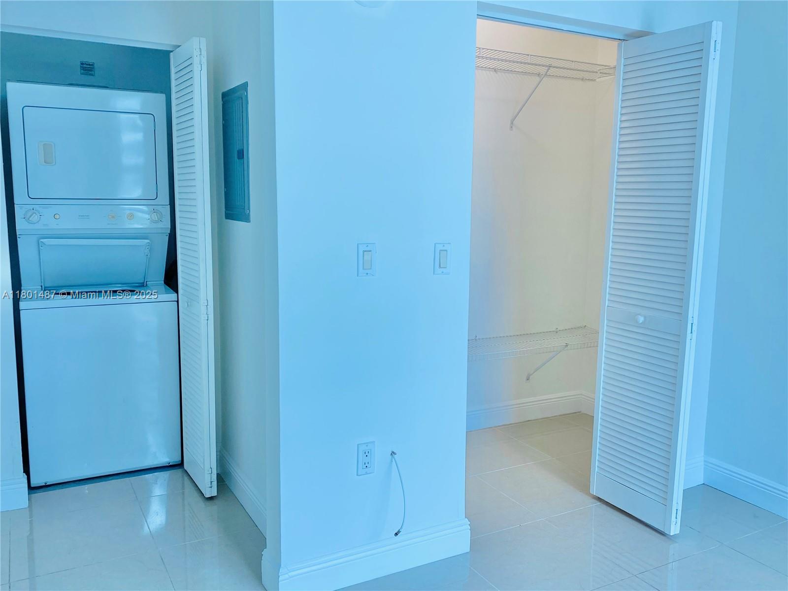 950 Brickell Bay Drive, Unit 401 Miami, FL 33131 - Photo 15 of 28 an empty room with closet