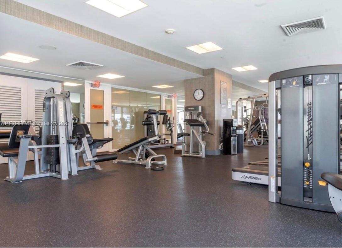 950 Brickell Bay Drive, Unit 401 Miami, FL 33131 - Photo 24 of 28 a view of a room with gym equipment
