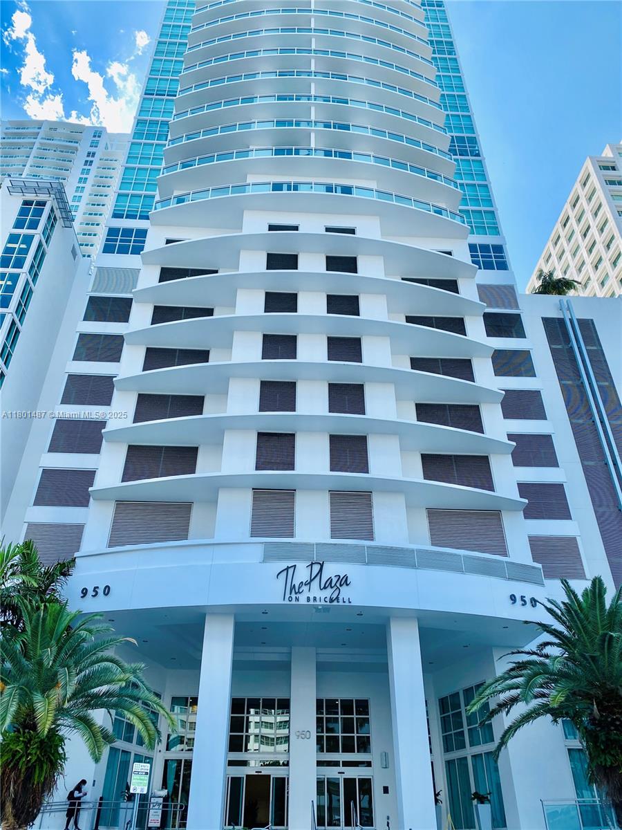 950 Brickell Bay Drive, Unit 401 Miami, FL 33131 - Photo 28 of 28 a view of a building with glass windows