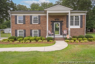 1012 Asbury Road Eastover, NC 28312 - Photo 1 of 38 front view of a house with a yard
