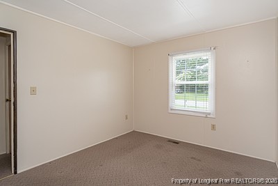 1012 Asbury Road Eastover, NC 28312 - Photo 19 of 38 an empty room with a window