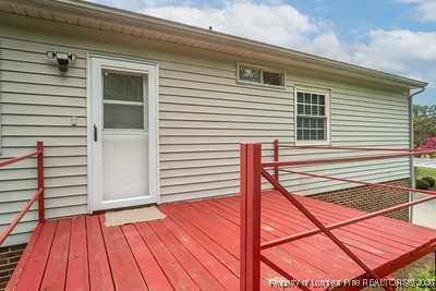 1012 Asbury Road Eastover, NC 28312 - Photo 36 of 38 a view of a balcony with wooden floor and fence